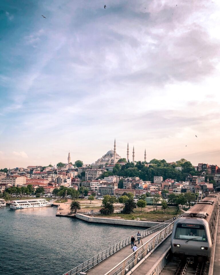 الرئيسية 10 gray and black train traveling on top of bridge during daytime